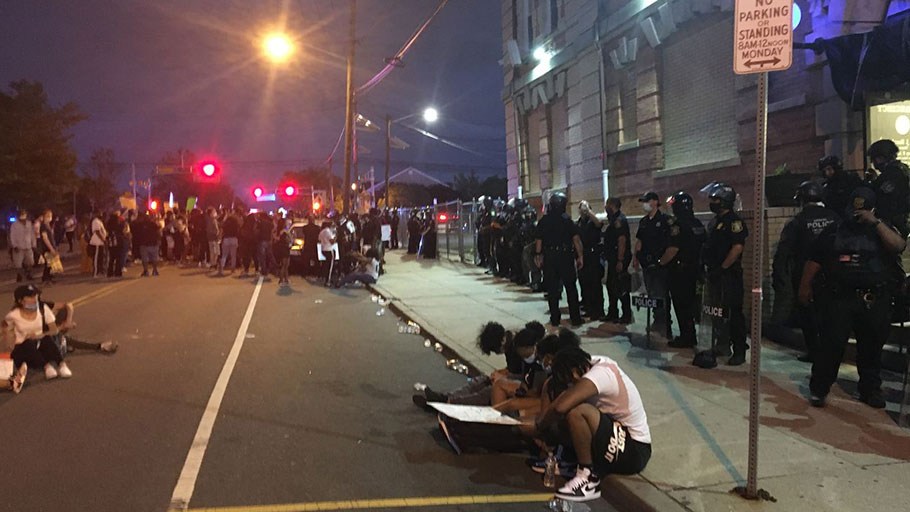 A demonstration outside the Newark Police Department's 1st Precinct station house was largely peaceful on Saturday. Fewer than 200 protestors remained by about 9 p.m., after police said a peak of at least 1,000 had gathered in front of the station earlier in the day. 
