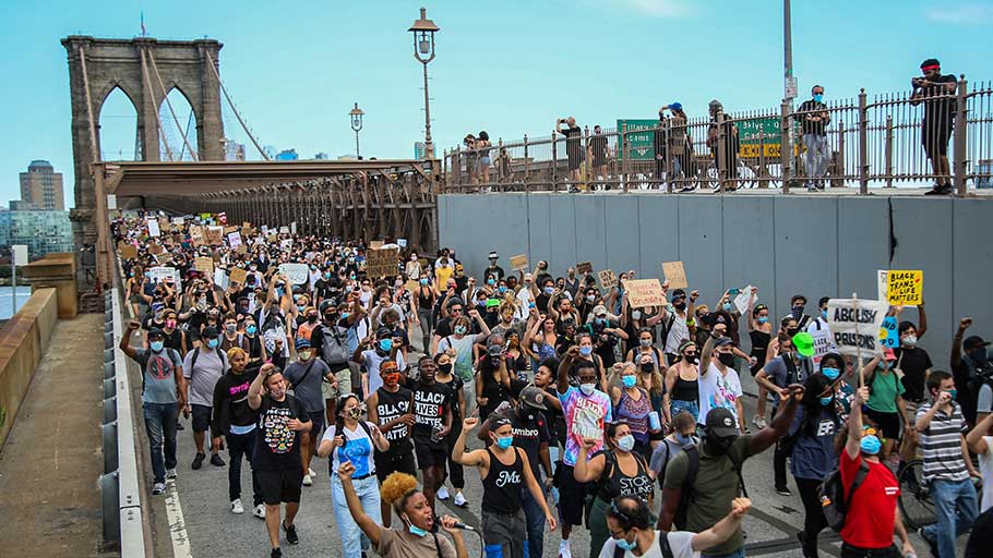 Protesters cross the Brooklyn Bridge on June 19, 2020 – Juneteenth – in the United States’ third straight week of protest.