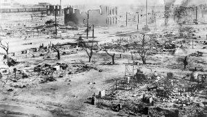 During the Tulsa race riots in 1921, black businesses and homes in the Greenwood District in Tulsa, Oklahoma, were destroyed at the hands of white residents.