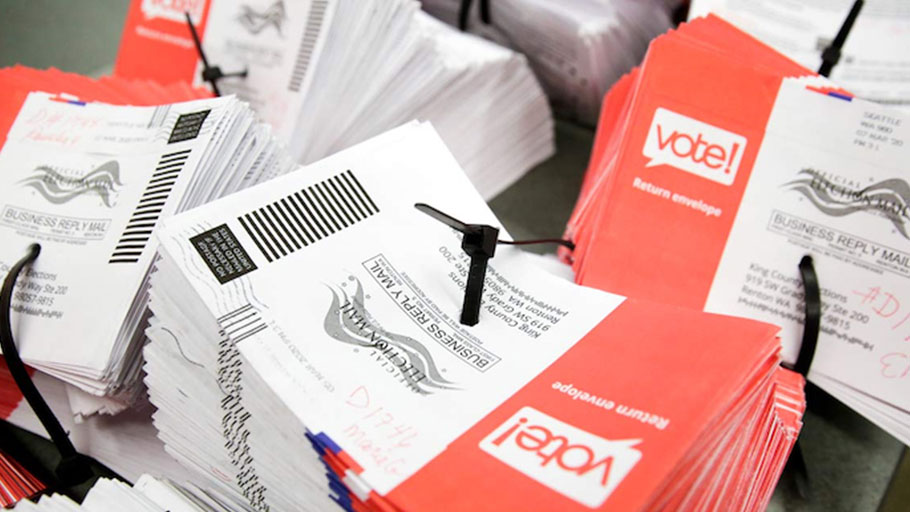 Empty envelopes of opened vote-by-mail ballots.