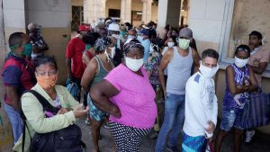 People line up to buy food amid concerns about the spread of the coronavirus disease (COVID-19), in downtown Havana, Cuba, April 3, 2020. Picture taken April 3, 2020.