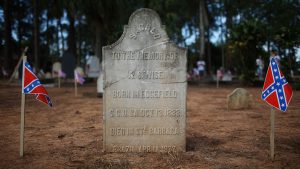 Confederate flags adorn the grave of a U.S. settler in the American Cemetery in Santa Bárbara d’Oeste during the 2016 Confederate Festival.