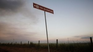 A sign points the way to the American Cemetery.