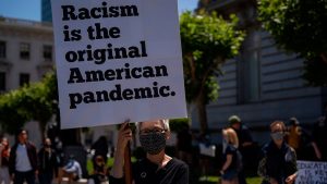 A woman takes part in a rally to mark Juneteenth on June 19 in San Francisco.