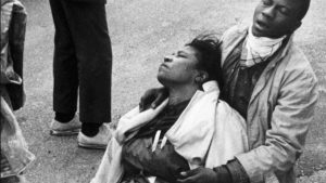 A civil rights marcher suffering from exposure to tear gas holds an unconscious Amelia Boynton Robinson after mounted police officers attacked marchers in Selma, Ala., as they were beginning a 50-mile march to Montgomery to protest race discrimination in voter registration.