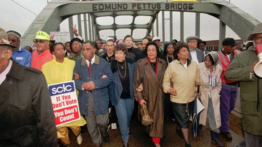 U.S. Rep. Cynthia McKinney, D-Ga.; SCLC President Joseph Lowery; Evelyn Lowery; Coretta Scott King; U.S. Rep. Eve Clayton,-D-N.C.; and Marie Foster cross the Edmund Pettus Bridge in Selma, Ala., to commemorate the 30th anniversary of the Selma-to-Montgomery civil rights march in 1995.
