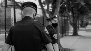 In 2013, when the Camden Police department relaunched under county control, it had two main objectives: reduce the crime rate, and make citizens feel safer. Above, two officers patrol the streets of the city on July 17.