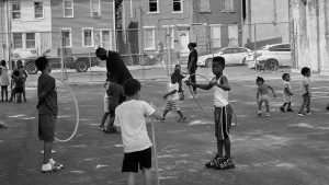 Minister Muhammad, who compares Camden’s old police department to a building so wrecked it was only worth tearing down, plays with children at Camden’s MEL Childcare Center, which is associated with his temple.