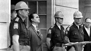 George Wallace blocking a federal agent from entering the University of Alabama to enroll Black students, 1963.