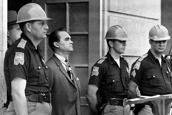 George Wallace blocking a federal agent from entering the University of Alabama to enroll Black students, 1963.
