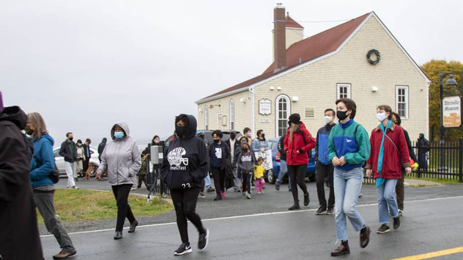out 100 people in cars and on foot made their way through the north end of Halifax on Saturday to protest the continued lack of reparations for the expropriation and demolition of Africville in the 1960s