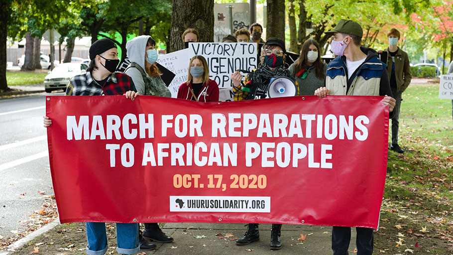“Protesters line up, ready to start the March for Reparations to African People