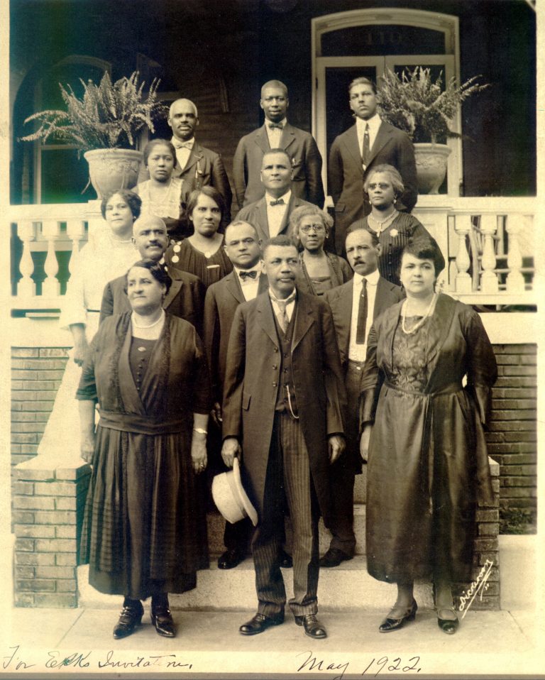 Maggie L. Walker, bottom left, and others in front of Walker's Jackson Ward home, May 1922.