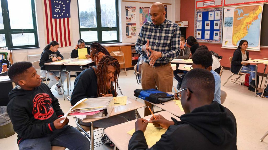 History teacher Philip Jackson teaches the history of slavery to his eighth-graders