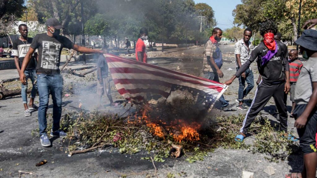 American flag burning in Haiti