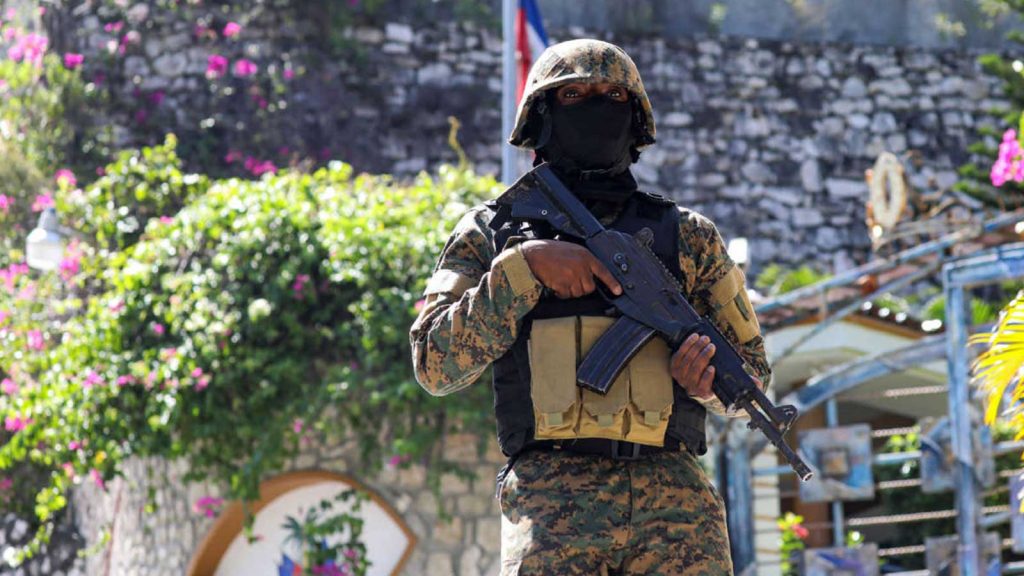 Haitian police patrol outside the presidential residence in Port-au-Prince