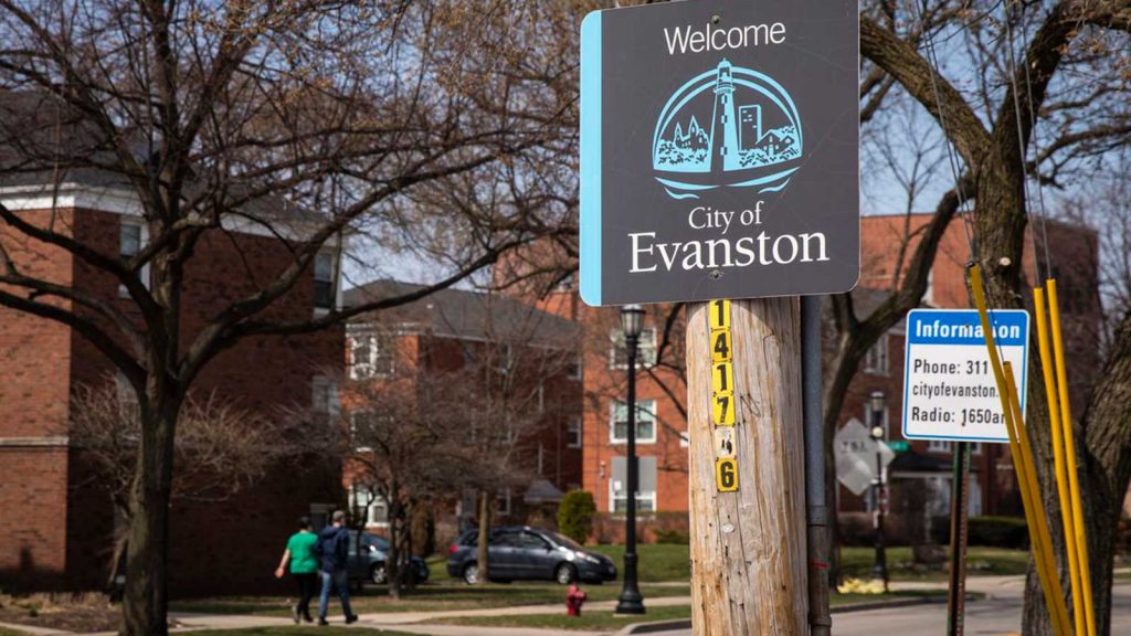 A “Welcome to Evanston” sign on Ridge Avenue at Howard Street. The city has the first municipally funded reparations program in the nation.