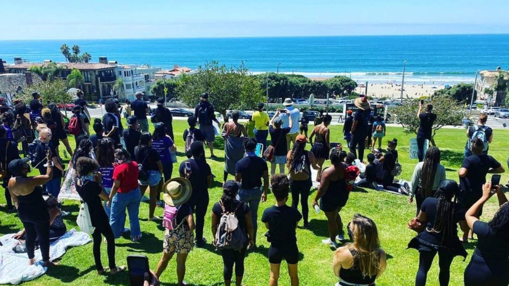 Demonstrators call for the return of Bruce’s Beach to the Bruce family in October 2020 in Manhattan Beach, California.