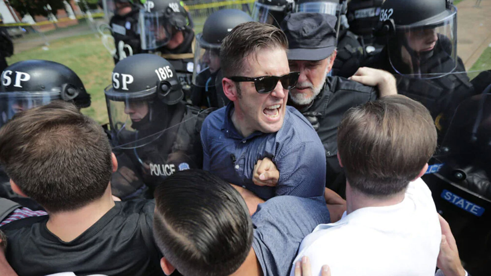 White nationalist Richard Spencer (C) and his supporters clash with Virginia State Police in Emancipation Park after the “Unite the Right” rally was declared an unlawful gathering August 12, 2017 in Charlottesville, Virginia.