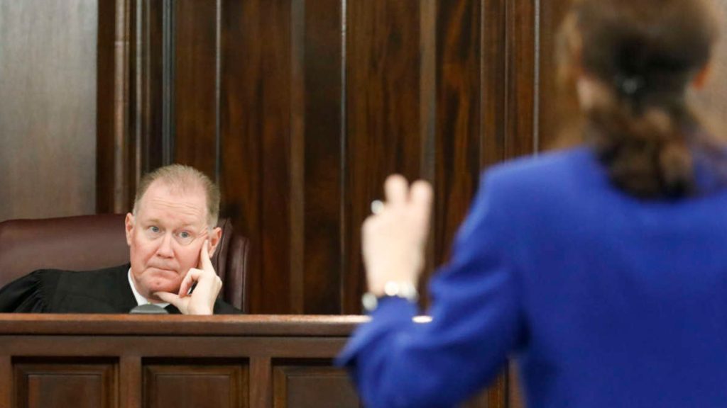 Prosecutor Linda Dunikoski stands in front of Judge Timothy Walmsley during the trial of the three men involved in the shooting of Ahmaud Arbery at Glynn County Superior Court on November 19, 2021, in Brunswick, Georgia.