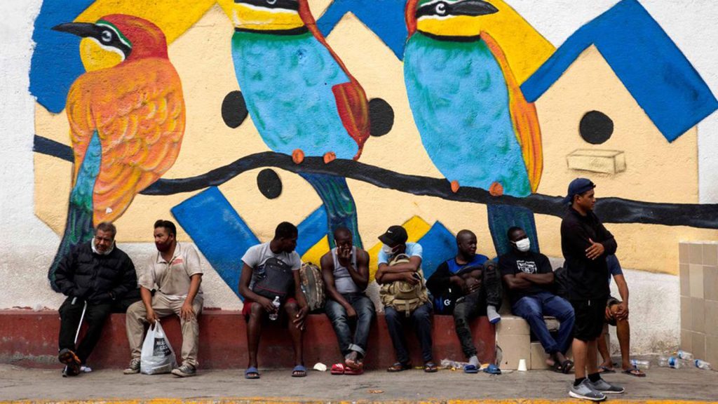 Haitian migrants rest outside a shelter in Monterrey, Mexico, on Sept. 26, where they awaited their immigration resolution