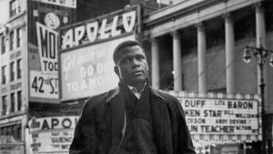 Sidney Poitier in front of the Apollo Theater, Harlem, NY