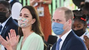 Prince William and Kate Middleton arrive at Sybil Strachan Primary School having passed a group of reparations protestors on their way to the event. March 25, 2022.