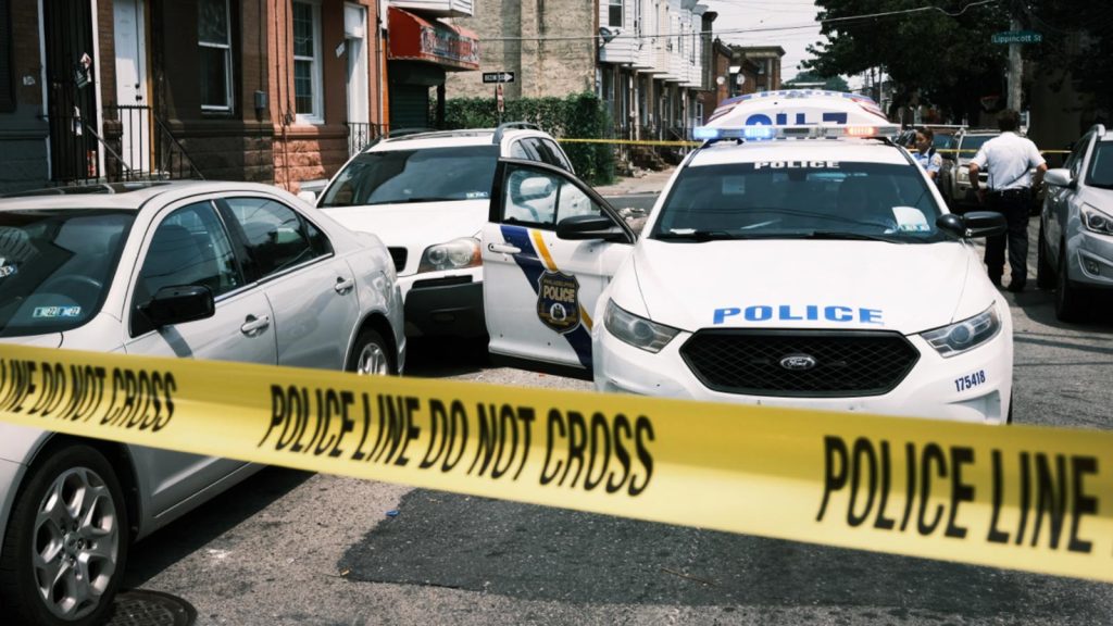 Police tape blocks a street where a person was shot in a drug-related incident in Philadelphia in 2021.