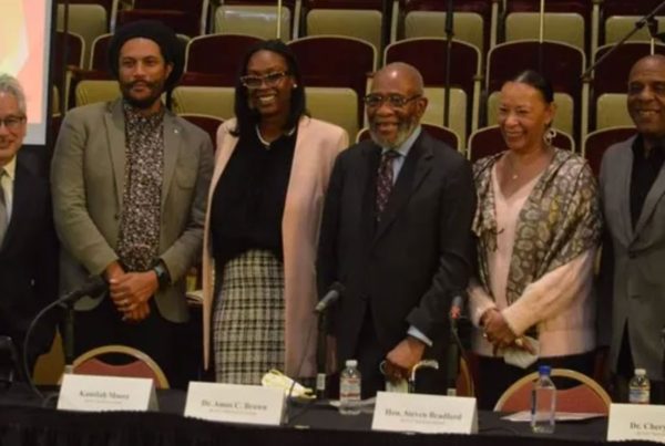 Six of the nine members of the California Task Force to Study and Develop Reparations Proposals for African Americans. From left to right are Don Tamaki, Jovan Scott Lewis, chair Kamilah Moore, vice-chair Dr. Rev. Amos Brown, Dr. Cheryl Grills, and California State Sen. Steven Bradford (D-Gardena).