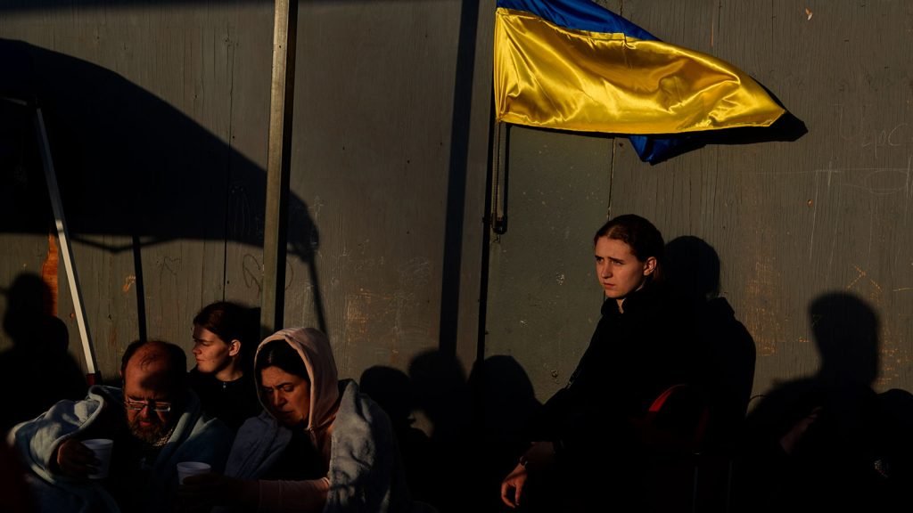 Ukrainian refugees wait near the U.S. border in Tijuana, Mexico.