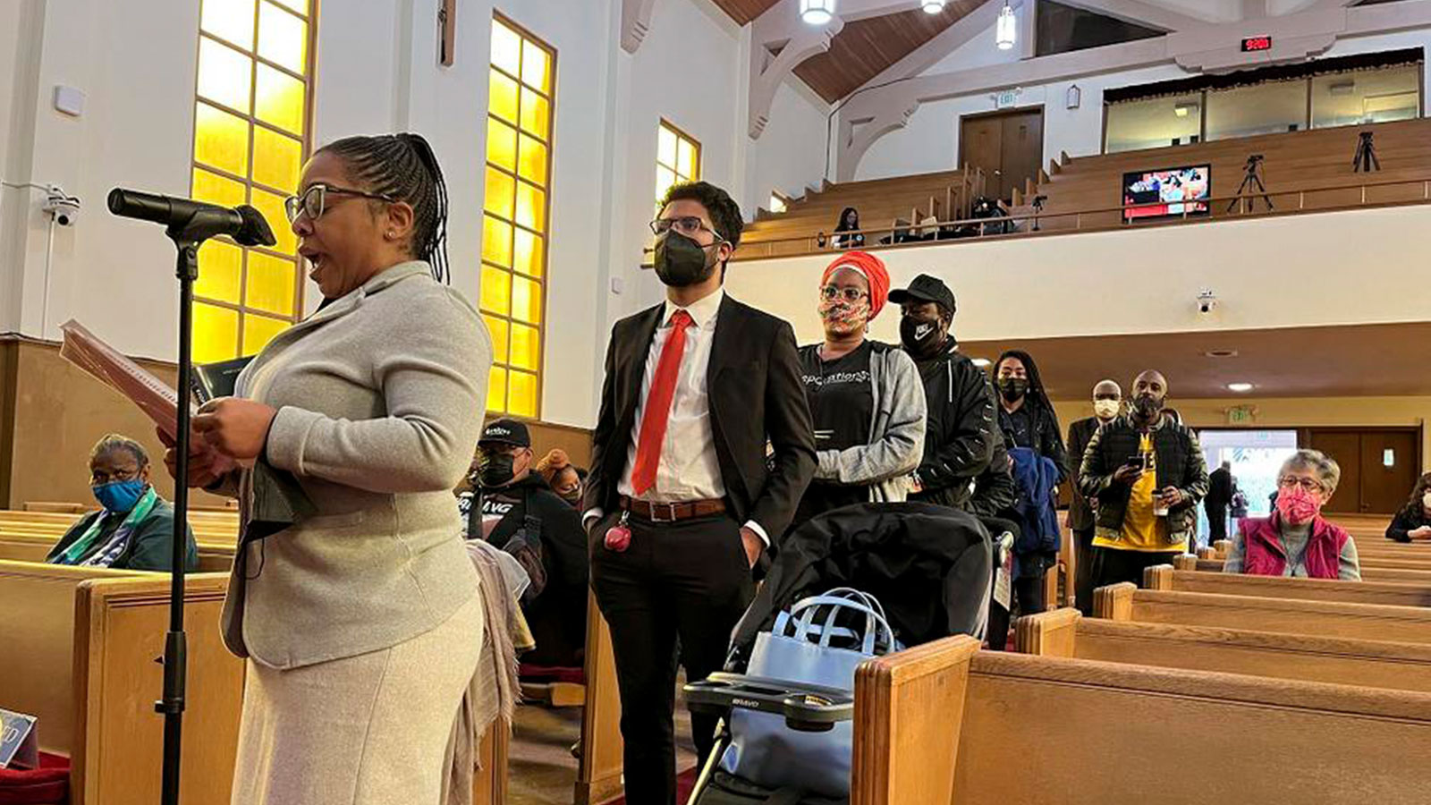 People line up to speak during a Reparations Task Force meeting at Third Baptist Church in San Francisco, April 13, 2022
