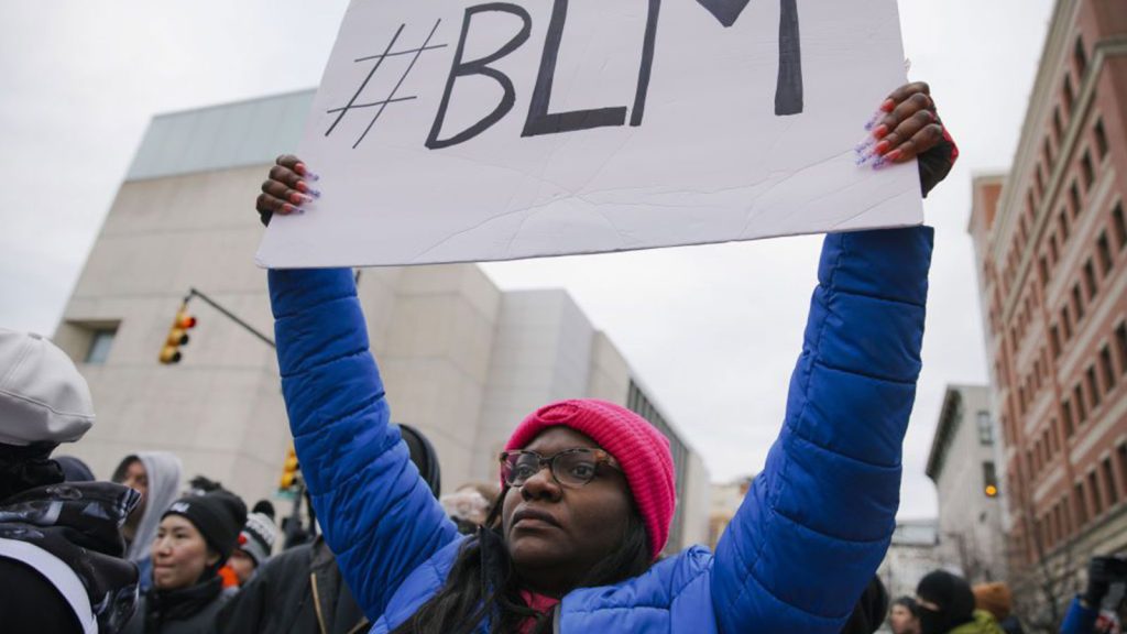BLM sign held high