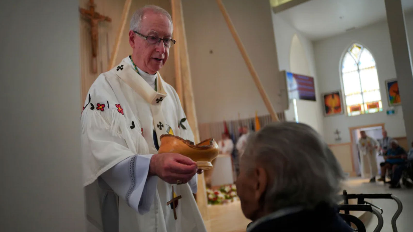Edmonton Archbishop Richard Smith gives communion during the rededication ceremony and Sunday Mass at Sacred Heart Church of the First Peoples earlier this week. The Pope will be visiting Edmonton during his visit next week. 