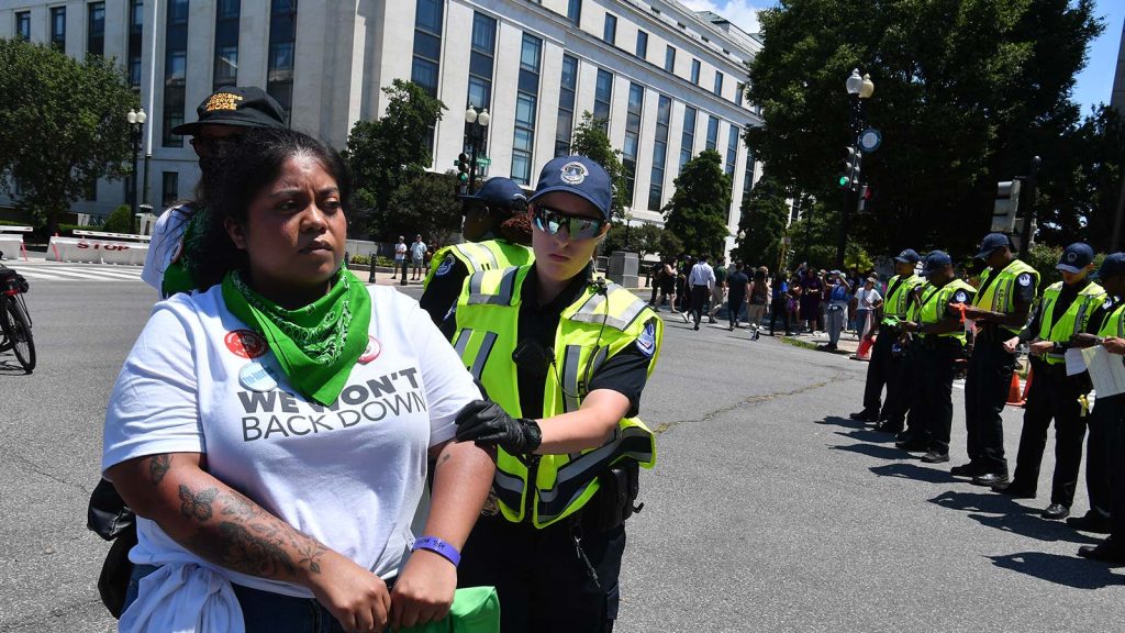 An abortion rights activists is detained on June 30, 2022, during a rally near the U.S. Supreme Court in Washington, D.C.