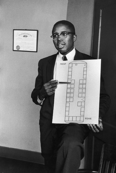 Fred Gray shows a diagram of a bus to help illustrate the ultimately successful case he brought on behalf of Black people in Montgomery, Alabama, to desegregate the city’s bus system, in February 1956.
