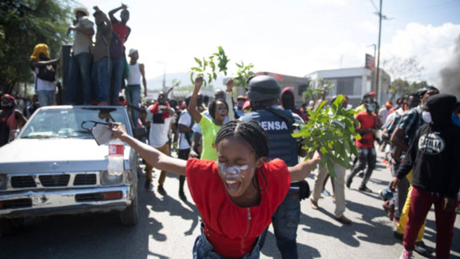 Factory workers in Port-au-Prince, Haiti, chant anti-government slogans during a protest demanding a salary increase.