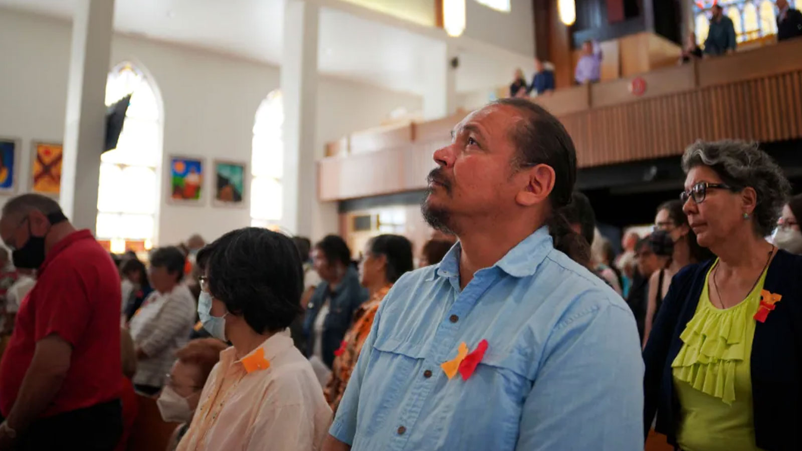 Parishioners attend the rededication ceremony of Sacred Heart Church of the First Peoples in Edmonton. The church was damaged in a fire but has been renovated ahead of Pope Francis's visit to Alberta. 