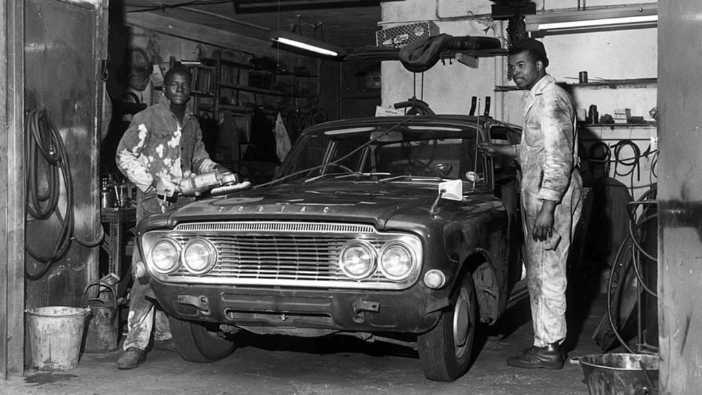 Workers in an auto repair shop in 1969.
