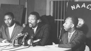 Boston Celtics legend Bill Russell, center, appears at meeting of the Boston branch of the NAACP.