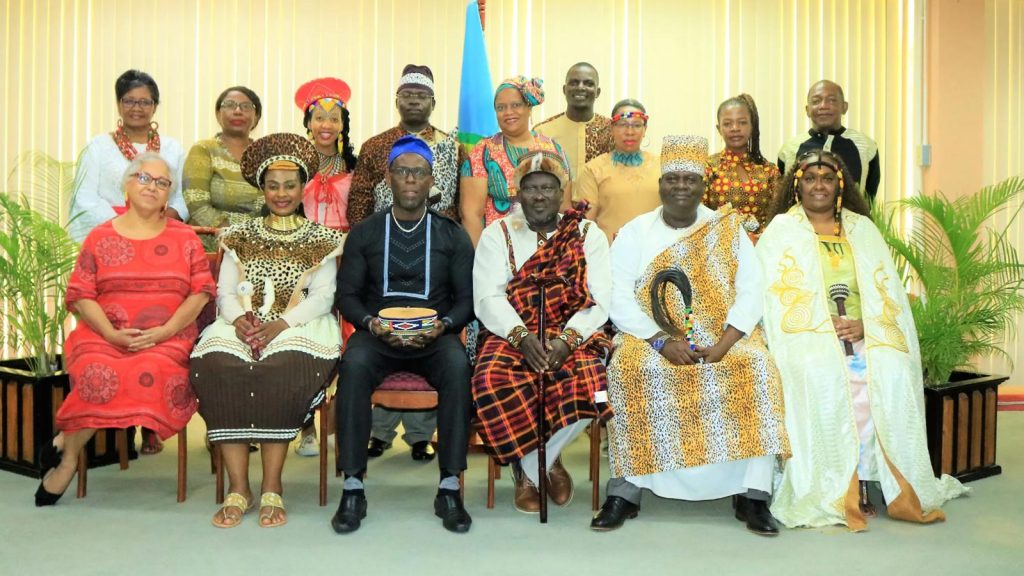 The Deputy Secretary-General, Dr Armstrong Alexis (3rd, L); Officials of the Secretariat (1st L & 4th R, back row) and the Royal African DelegationThe Deputy Secretary-General, Dr Armstrong Alexis (3rd, L); Officials of the Secretariat (1st L & 4th R, back row) and the Royal African Delegation
