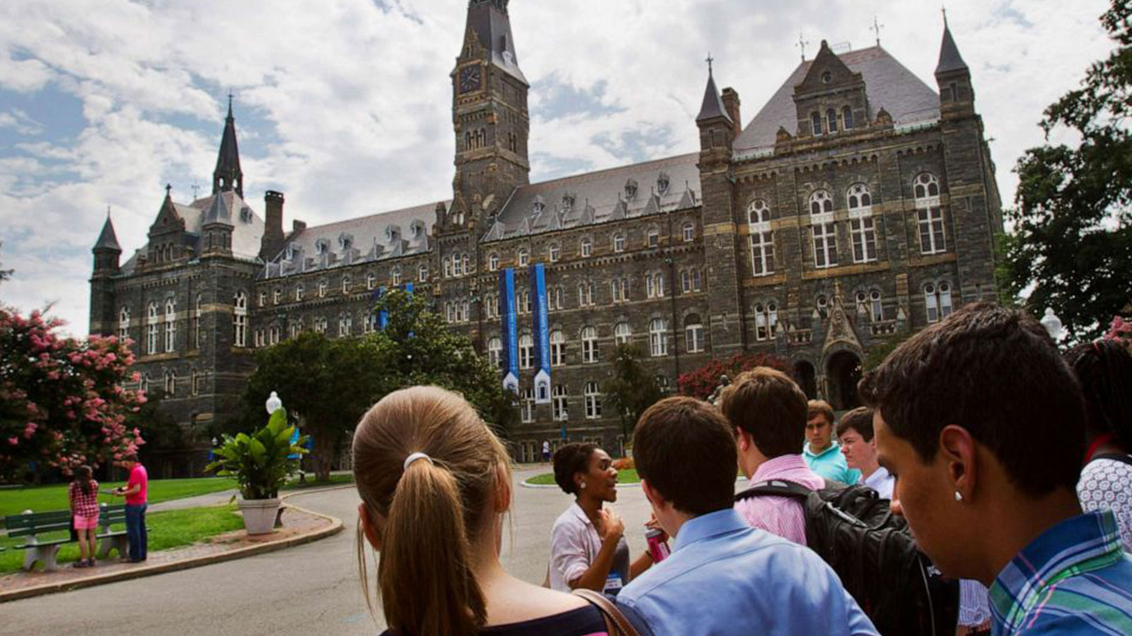 Prospective students tour Georgetown University's campus in Washington, July 10, 2013. 