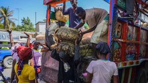 Unloading a truck in Port-au-Prince, where gang violence has made it more difficult for residents to get basic goods.