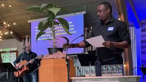 Andrew Ndayambaje, a member of Salt House Church in Kirkland, Wash., and part of the church's reparations committee, participates in a libation ceremony to honor Juneteenth at a June 19 morning service.