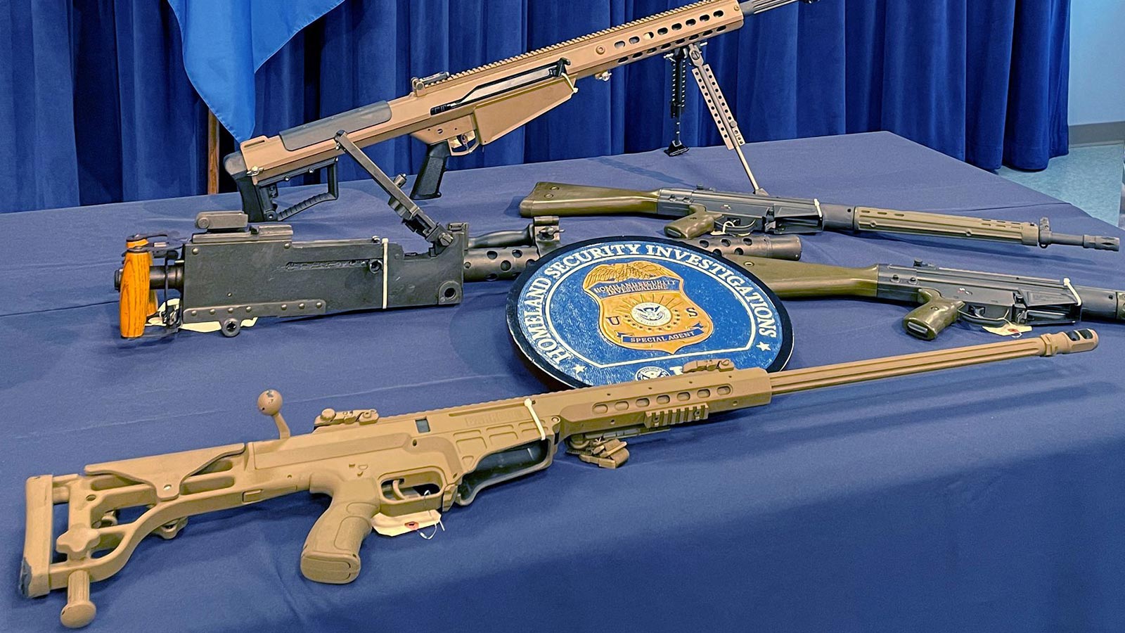 Weapons seized by U.S. authorities that had been destined for illegal export to Haiti are displayed during a news conference in Miami, Florida, U.S. August 17, 2022.