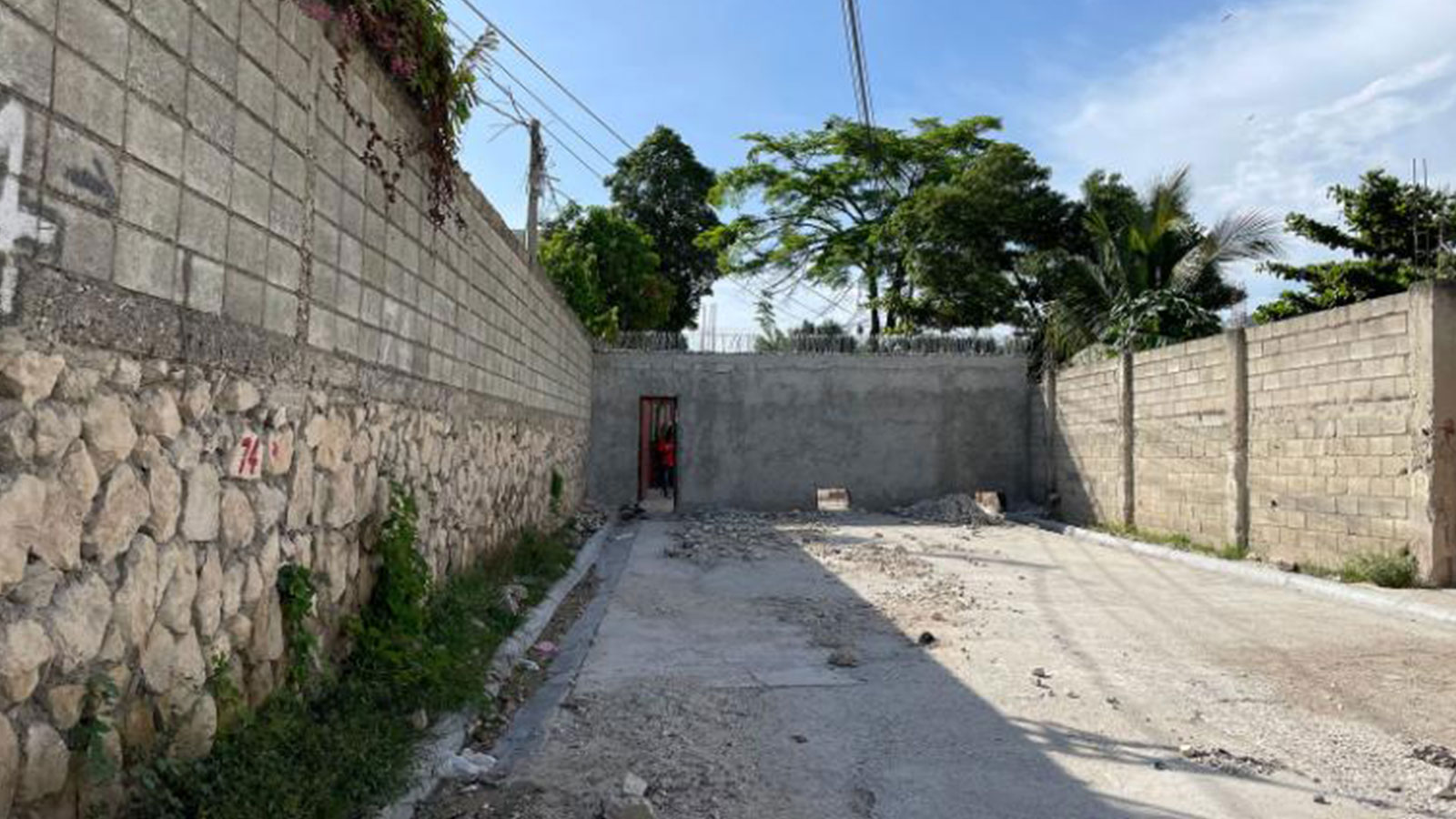 People in this neighborhood built a wall on a public road last month to keep out gangs who were kidnapping residents for ransoms.