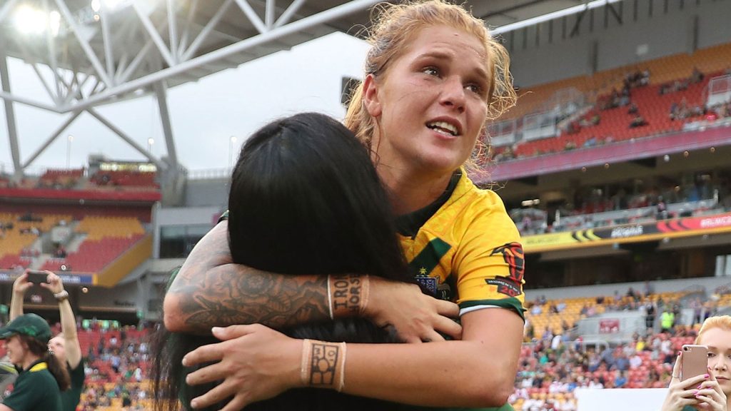 Caitlin Moran celebrates with team mates after winning the 2017 rugby league women's world cup final in 2017.