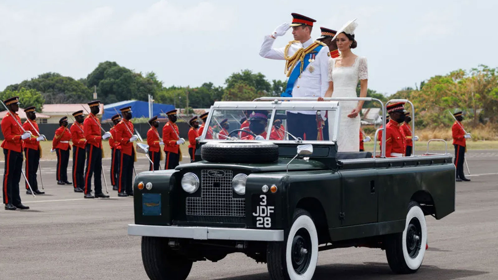 Catherine, Duchess of Cambridge and Prince William, Duke of Cambridge, ride in a Land Rover 
