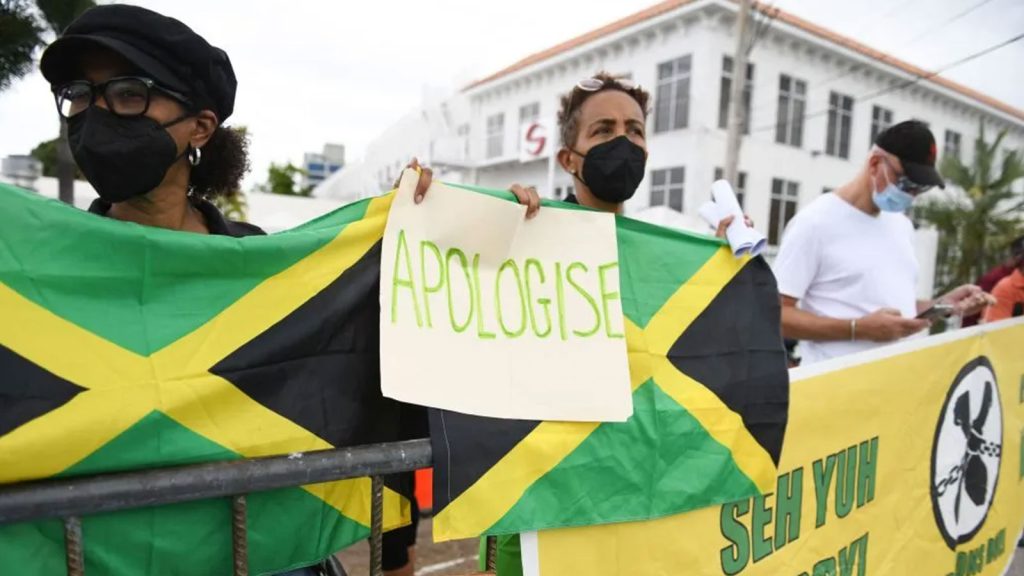 People calling for slavery reparations, protest outside the entrance of the British High Commission during the visit of the Duke and Duchess of Cambridge in Kingston, Jamaica on Mar. 22, 2022.