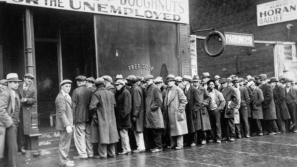 Unemployed men lined up outside a soup kitchen in Chicago in 1931