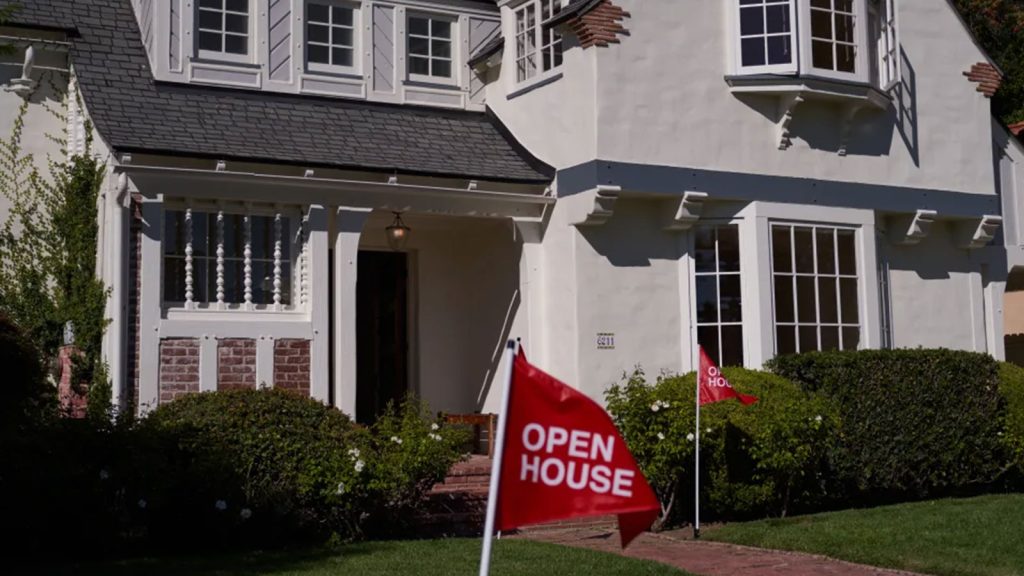An 'open house' flag is displayed outside a single family home on September 22, 2022 in Los Angeles, California. The U.S. housing market is seeing a slow down in home sales due to the Federal Reserve raising mortgage interest rates to help fight inflation.